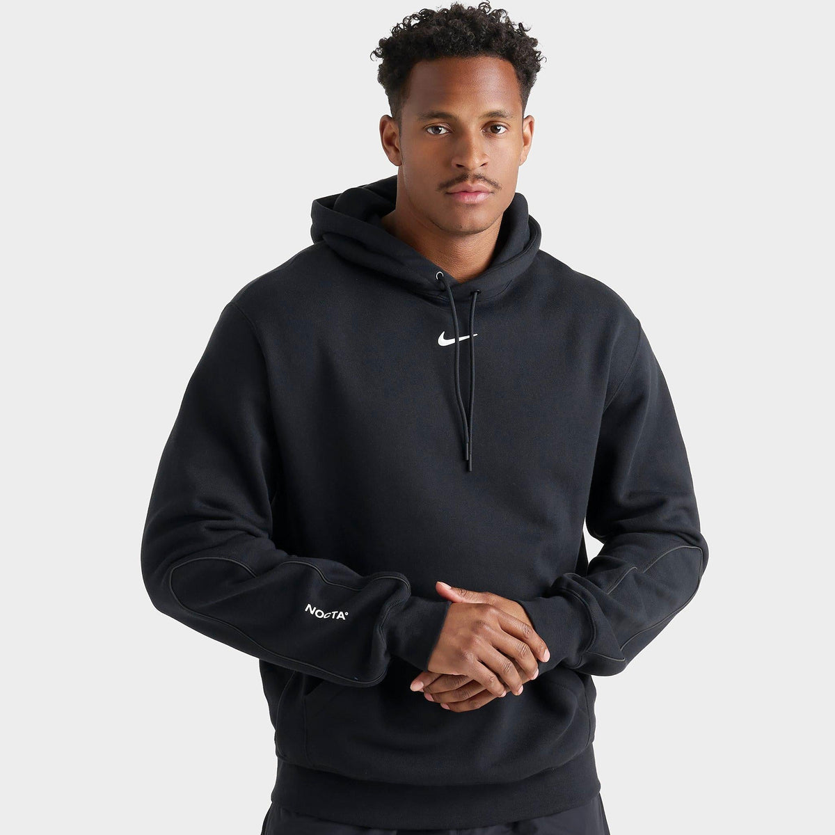 Tuta Nike Nocta con cappuccio