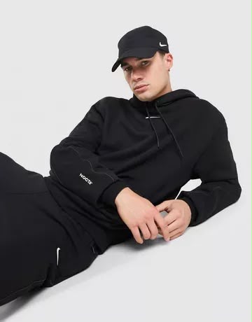 Tuta Nike Nocta con cappuccio