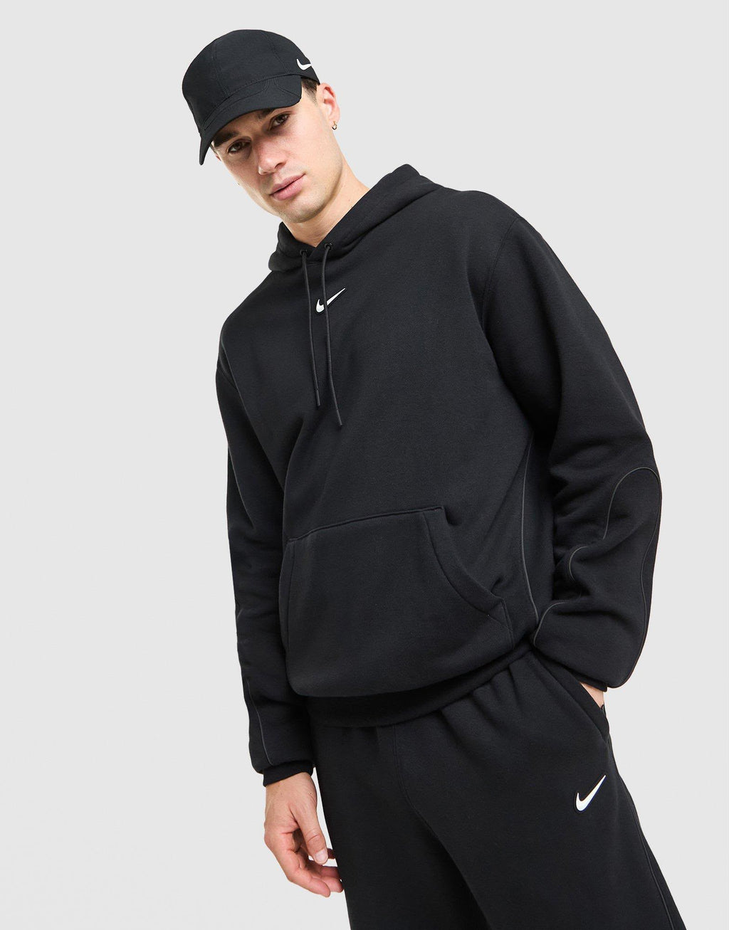 Tuta Nike Nocta con cappuccio
